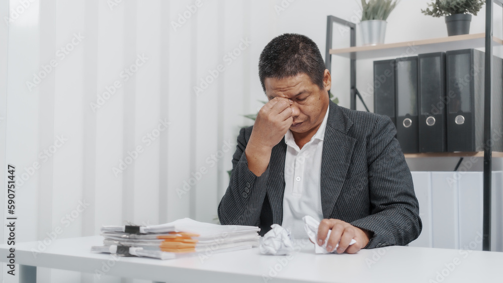 Tired, Elderly Old Senior Asian male businessman wearing formal suit ,confident professional bookkeeper doing bookkeeping, lawyer, stock market trader or broker. Tired, Elderly Old Senior Asian male businessman wearing formal suit ,confident professional bookkeeper doing bookkeeping, lawyer, stock market trader or broker.