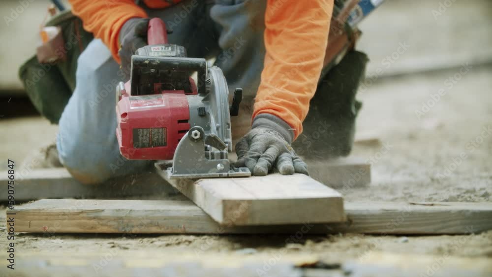 Beautiful view of an hardworking constructor using a drill for making a building Beautiful view of an hardworking constructor using a drill for making a building