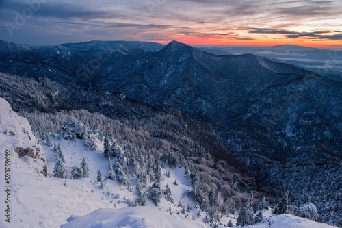 Slovakia mountain at winter. Winter sunset with forest in Slovakia from peak Tlsta  Fatra. Winter hike.