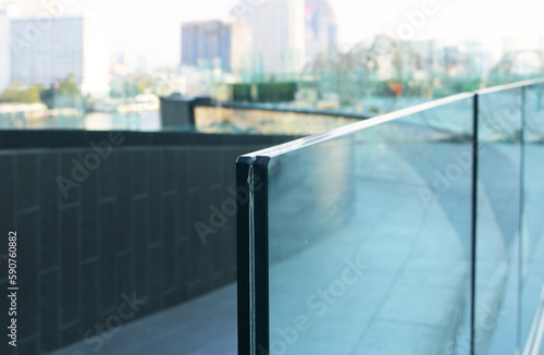 Fotobehang Frameless laminated glass railing outdoor.