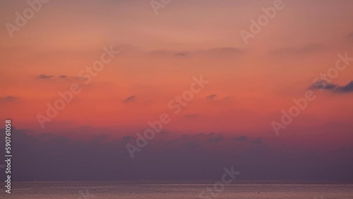 time lapse sweet sky in twi.aerial view stunning sky in sunset above the sea..colorful cloud in bright sky of sunset above the ocean at Khao Khad Phuket. .Majestic sunset or sunriselight over the sea. photo