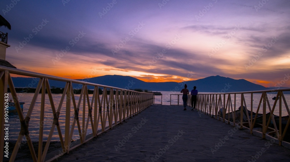 Landscape of a pier over Lake Chapala during the sunset in Mexico