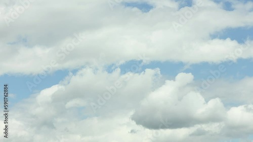 Blue sky white clouds. Cloud time lapse. Cumulus cloud cloudscape timelapse. The clouds move from left to right. 4K UHD video footage 3840X2160. photo