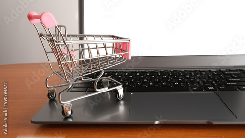 Grocery cart on computer keyboard.