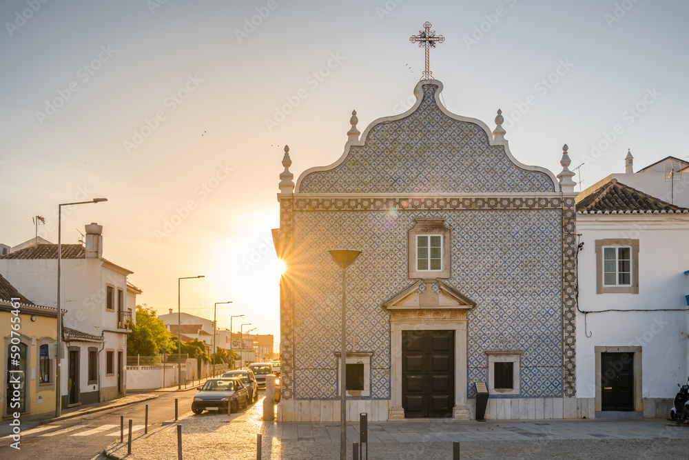 Nossa Senhora do Livramento church at sunrise in Tavira town, Algarve region, Portugal.