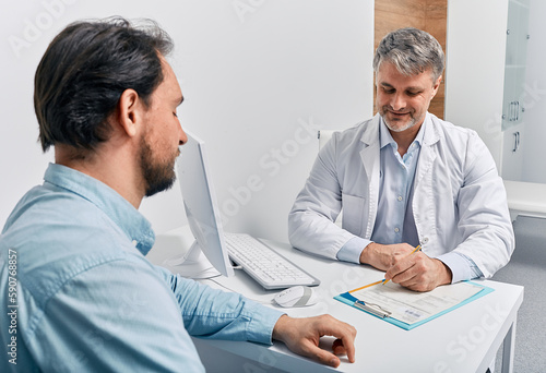 Obraz na plátně Consultation with urologist-andrologist to man patient and his male reproductive system and sperm health