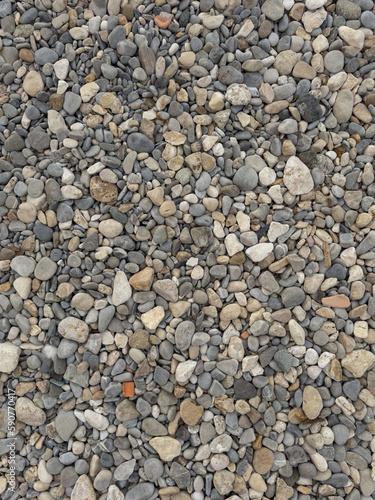 Texture of pebble beach with various stones