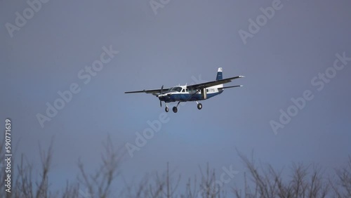Fixed wing monoplane landing on a grass runway