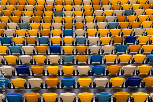 Football and soccer stadium empty tribune colorful seats