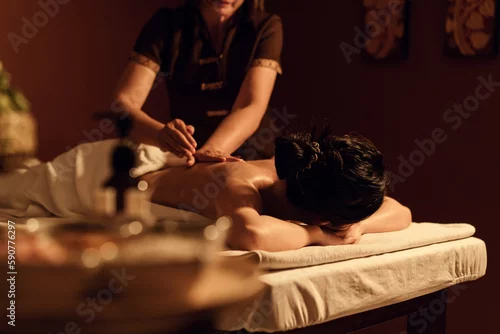 Fototapeta samoprzylepna Relaxation woman back massage with masseur in cosmetology spa centre.