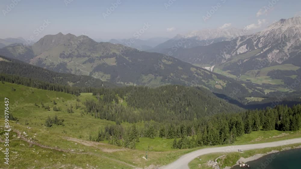 Beautiful view of a water reservoir on a hill with a scenic natural surrounding Beautiful view of a water reservoir on a hill with a scenic natural surrounding