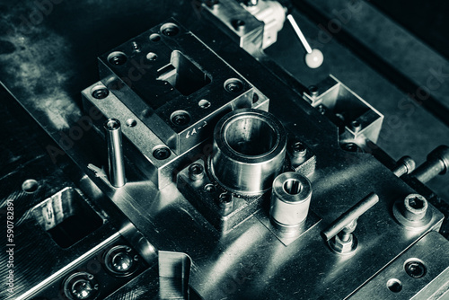 Sheet Metal Stamping Tool Die for Automotive Precision Parts on The Numerical Control Milling Machine Table. Tandem Stamping System. At a High Quality Technology Factory. Black and White Photography.
