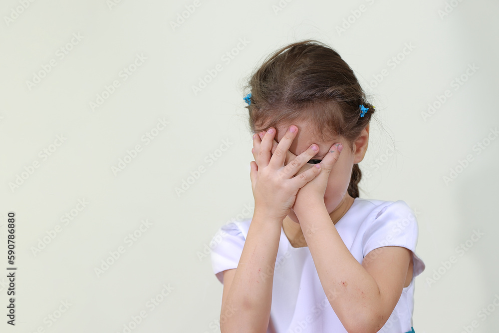 little girl covers her face with her hands in fear little girl covers her face with her hands in fear