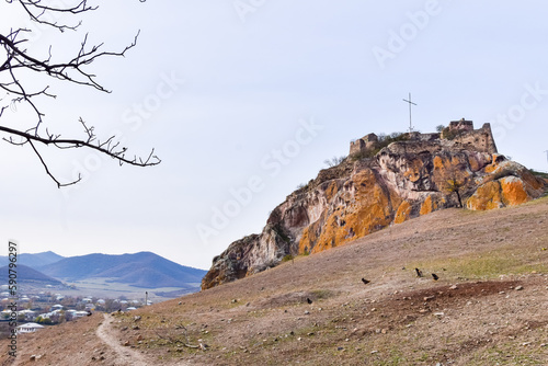 Kveshi fortress with pathway and cross on top. Historical and cultural heritage n Georgia. photo