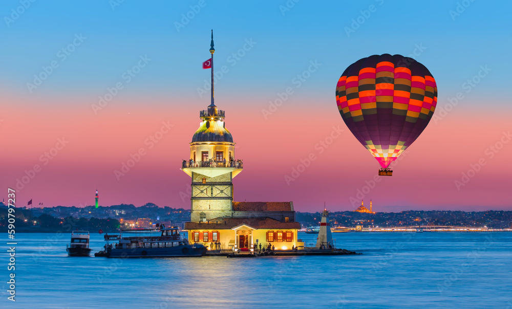 Hot air balloon flying over Istanbul Maiden Tower (kiz kulesi) with at