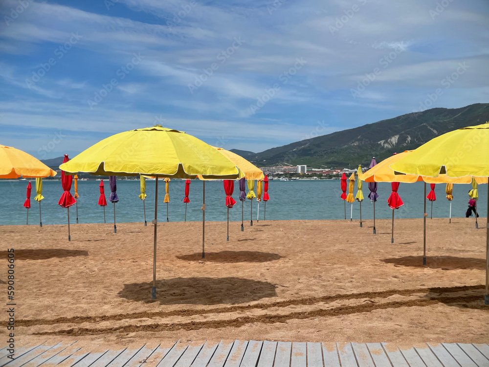 Fototapeta premium Empty sand beach with umbrella on Turkish resort, consequences of the pandemic