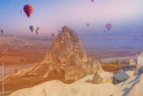 Landscape sunrise in Cappadocia with set colorful hot air balloon fly in sky with sun light. Concept tourist travel Goreme Turkey
