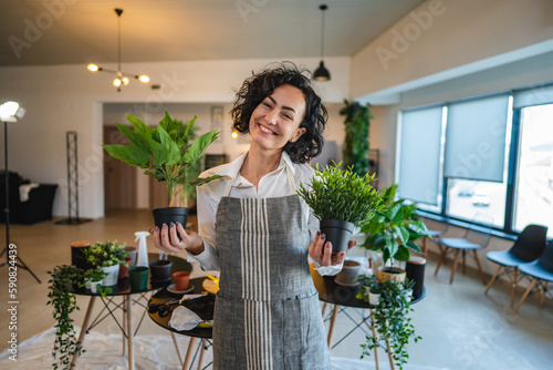 Canvastavla portrait of woman mature caucasian female take care of plants at home
