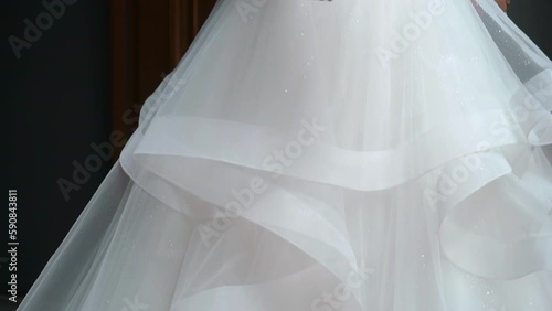 Wallpaper Mural A bride in a long white wedding dress and high-heeled shoes walks on a tiled floor. Wedding ceremony, reception. Torontodigital.ca