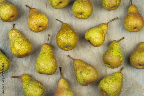 Pears on a wooden background. Fruit harvest. Autumn still life. Pear variety Bera Conference. Vitamin food.