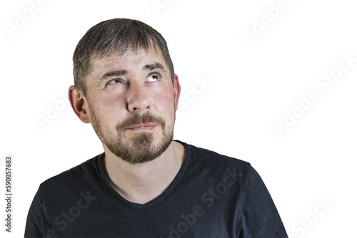 Portrait of an attractive bearded man of European appearance, with a slight gray hair, on an isolated white background. He looks up thoughtfully. Expression of emotions of a man.
