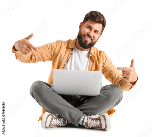 Young bearded man pointing ...