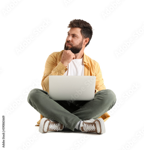 Thoughtful young bearded ma...