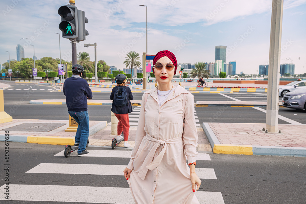 scooters and indian girl crosses the road at the zebra crossing. Rules