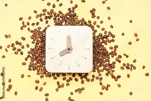 Stylish clock and coffee be...