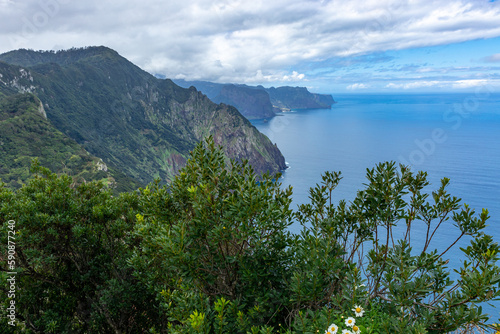 Madeira. Hiking trail Vereda Boca do Risco. Steep Cliffs over the Atlantic Ocean. Near Machico and Canical. Madeira Island, Portugal.