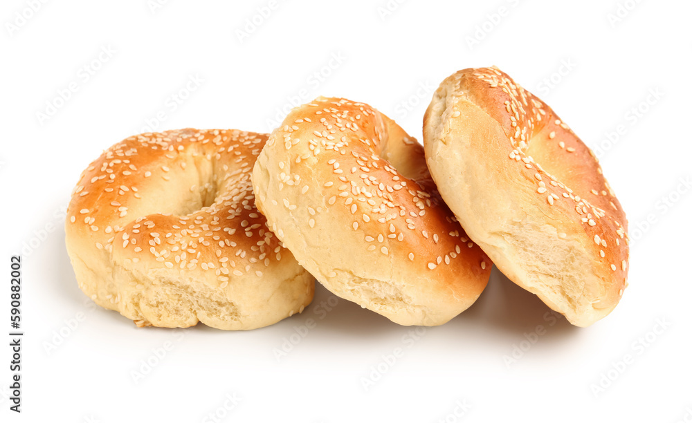 Tasty bagels with sesame seeds on white background Tasty bagels with sesame seeds on white background