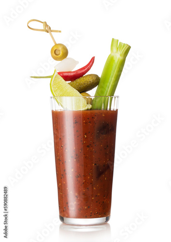 Glass of bloody mary cocktail mix with black pepper and celery on white background with pickle and olive. © DenisMArt