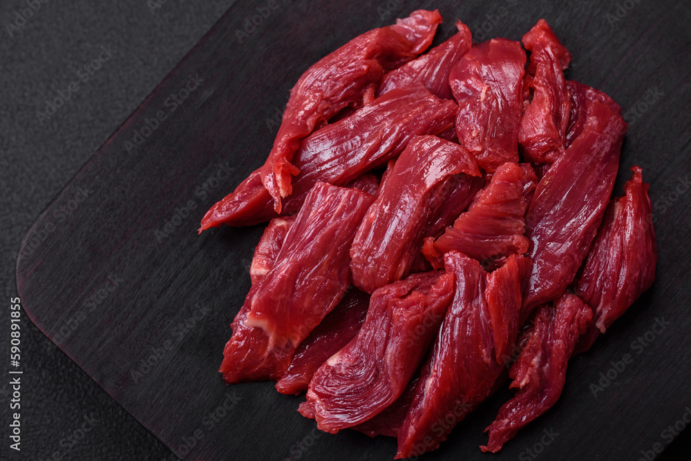 Fototapeta premium Fresh raw beef with salt, spices and herbs