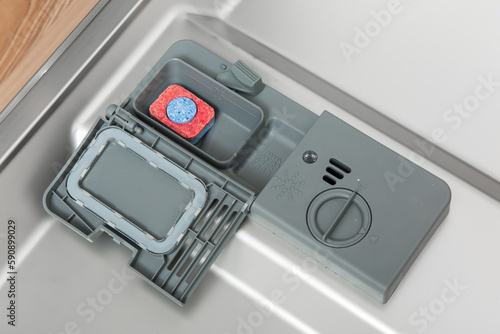Dishwasher detergent dispenser with tab