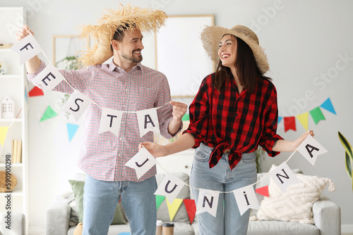 Young couple with flags cel...