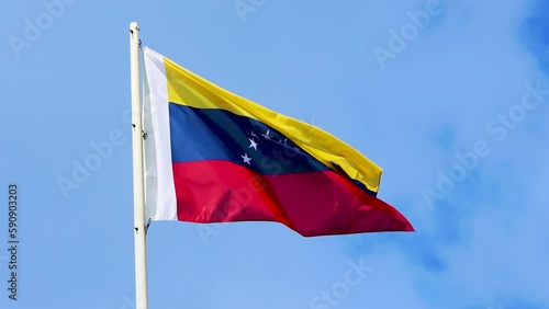 Flag of Venezuela. Waving Venezuela Flag, 4K video. National Venezuelan Flag in the sky of Venezuela