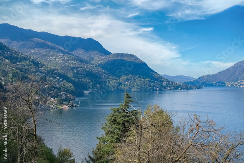 Como city in Italy, view of the city from the lake, with mountains in background 