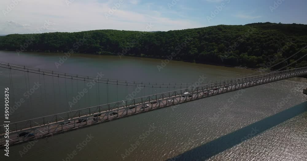 Aerial of traffic on Mid Hudson Bridge over Hudson River in Poughkeepsie New York on Bright Sunny Summer Day Aerial of traffic on Mid Hudson Bridge over Hudson River in Poughkeepsie New York on Bright Sunny Summer Day