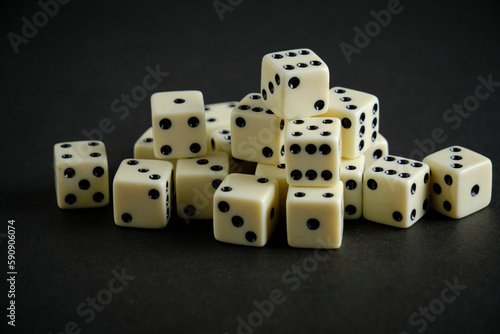 Bunch of ivory dice on black background.