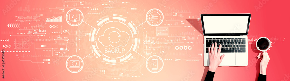 Backup concept with person using a laptop computer Backup concept with person using a laptop computer