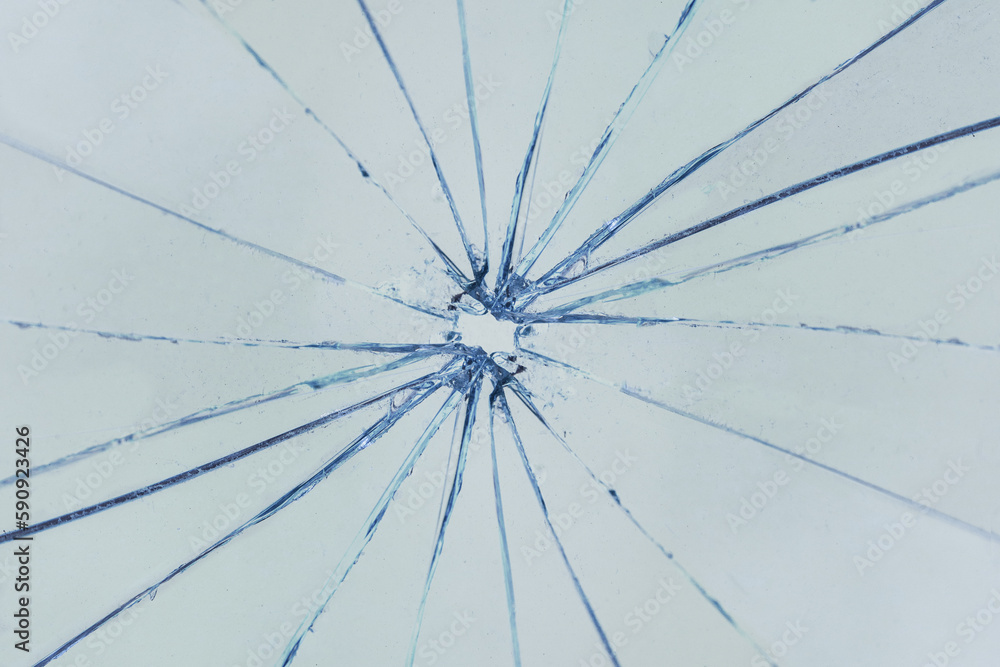 Cracks on glass, broken window, background texture Cracks on glass, broken window, background texture