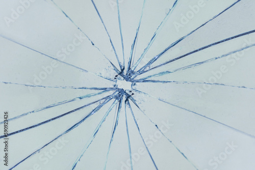 Cracks on glass, broken window, background texture