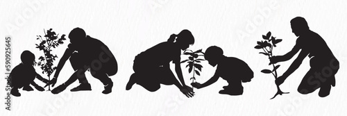 A silhouette of a family planting a tree