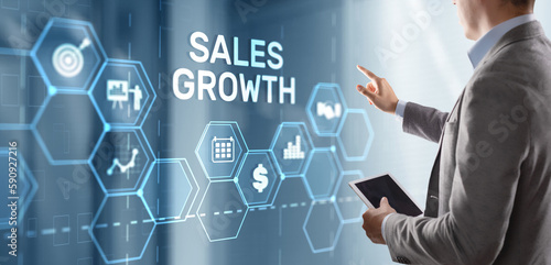 Sales Growth Man clicks inscription on virtual 3D screen