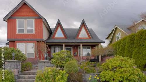 Wallpaper Mural Establishing shot of two story stucco luxury house with garage door, big tree and nice spring blossom landscape in Vancouver, Canada, North America. Day time on Apr 2023. ProRes 422 HQ. Torontodigital.ca