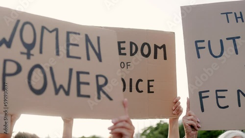 Group of feminist women protest for female rights holding signs at demonstration outdoor - Empowerment and equality concept photo