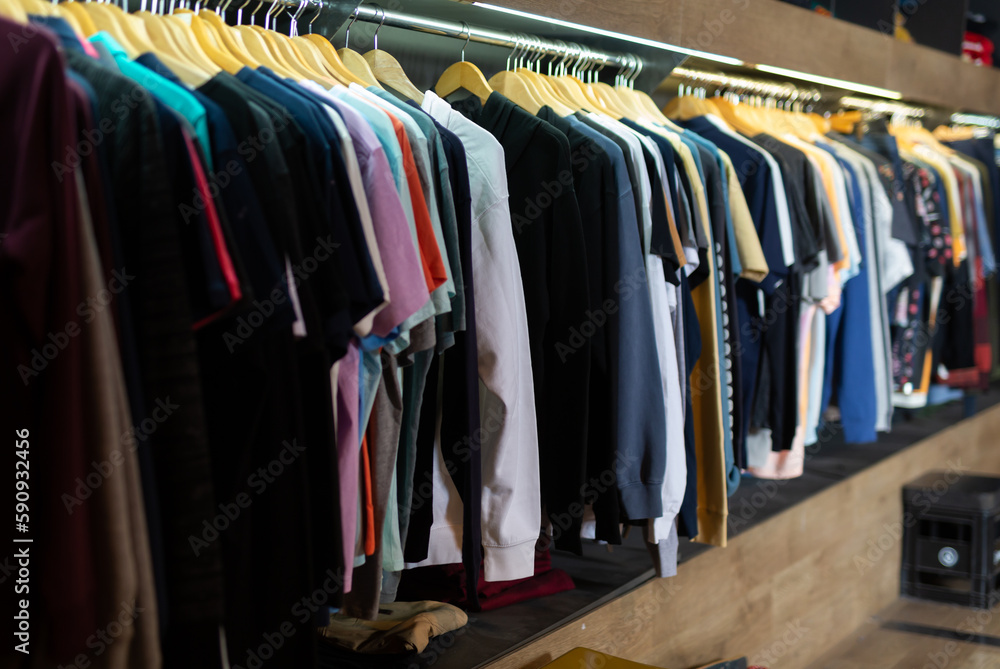 Close up of male shirts on hangers in clothing store