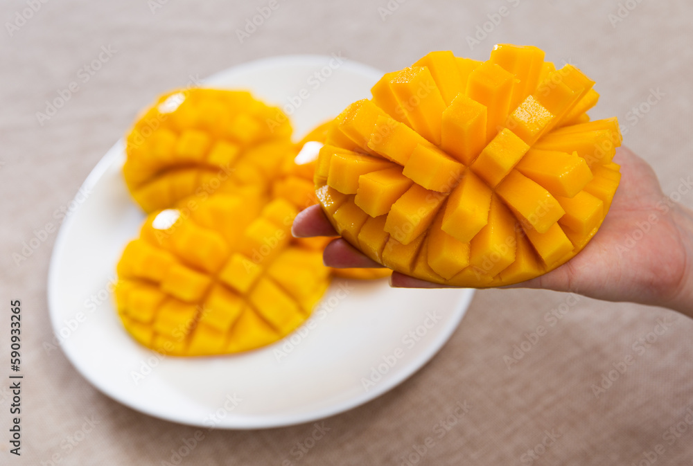 Juicy pieces of diced mango fruit served on platter