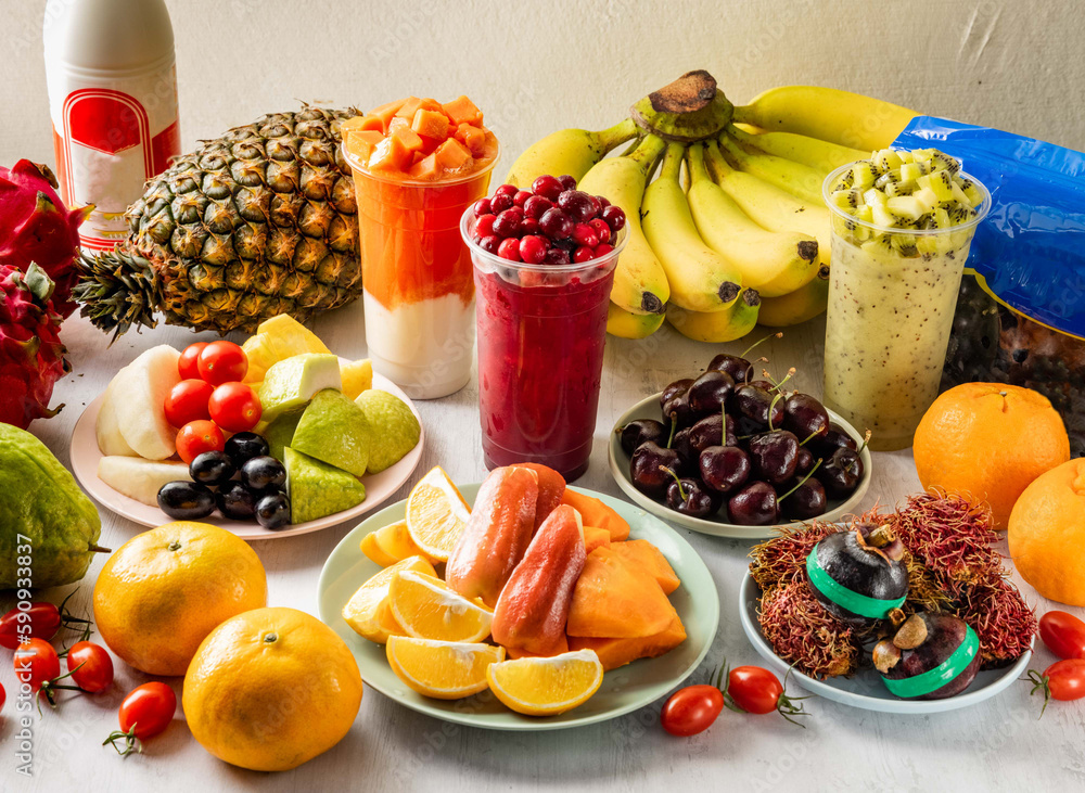 Super Mixed fruits and Juice with pineapple, banana, plum, tomato, pears, kiwi, red dragon fruit, papaya, duriyan strawberry, blueberry, blackberry, raspberry, cherry and cranberry raw fruits served Super Mixed fruits and Juice with pineapple, banana, plum, tomato, pears, kiwi, red dragon fruit, papaya, duriyan strawberry, blueberry, blackberry, raspberry, cherry and cranberry raw fruits served