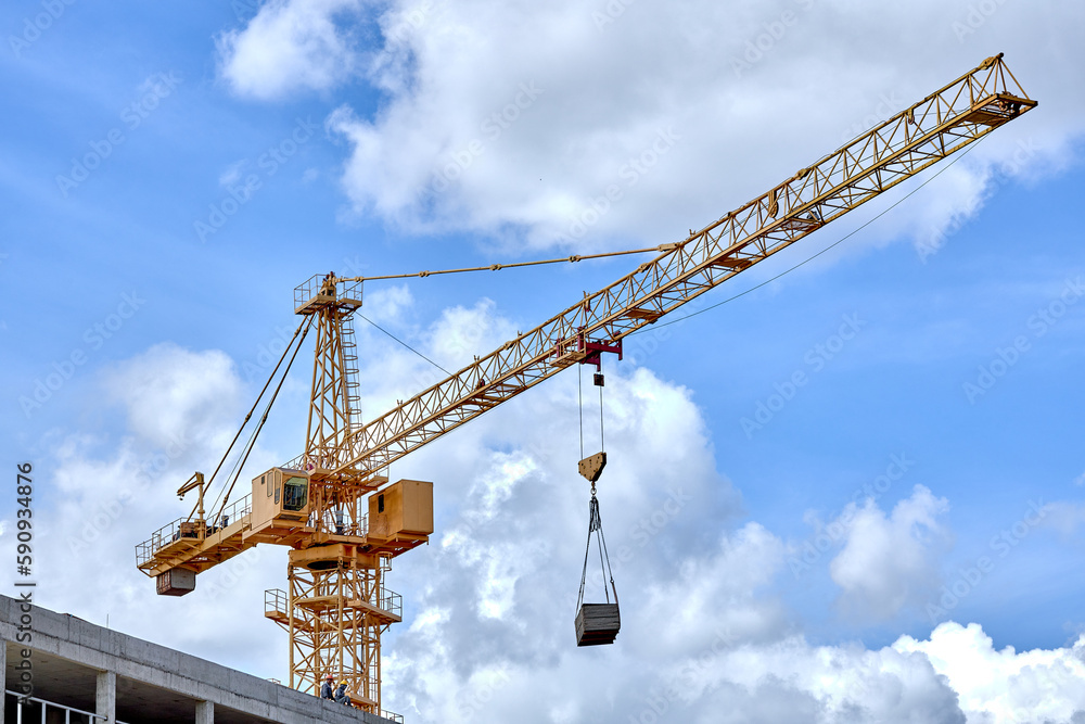 construction crane on a blue sky background.